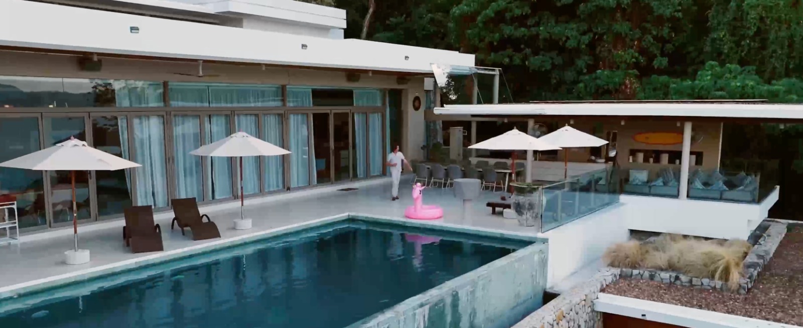 Modern house with a pool, shown in the partner story